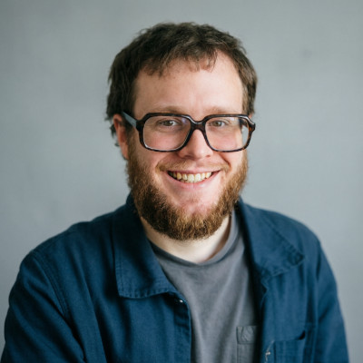 Close up photo of William Welsh smiling.